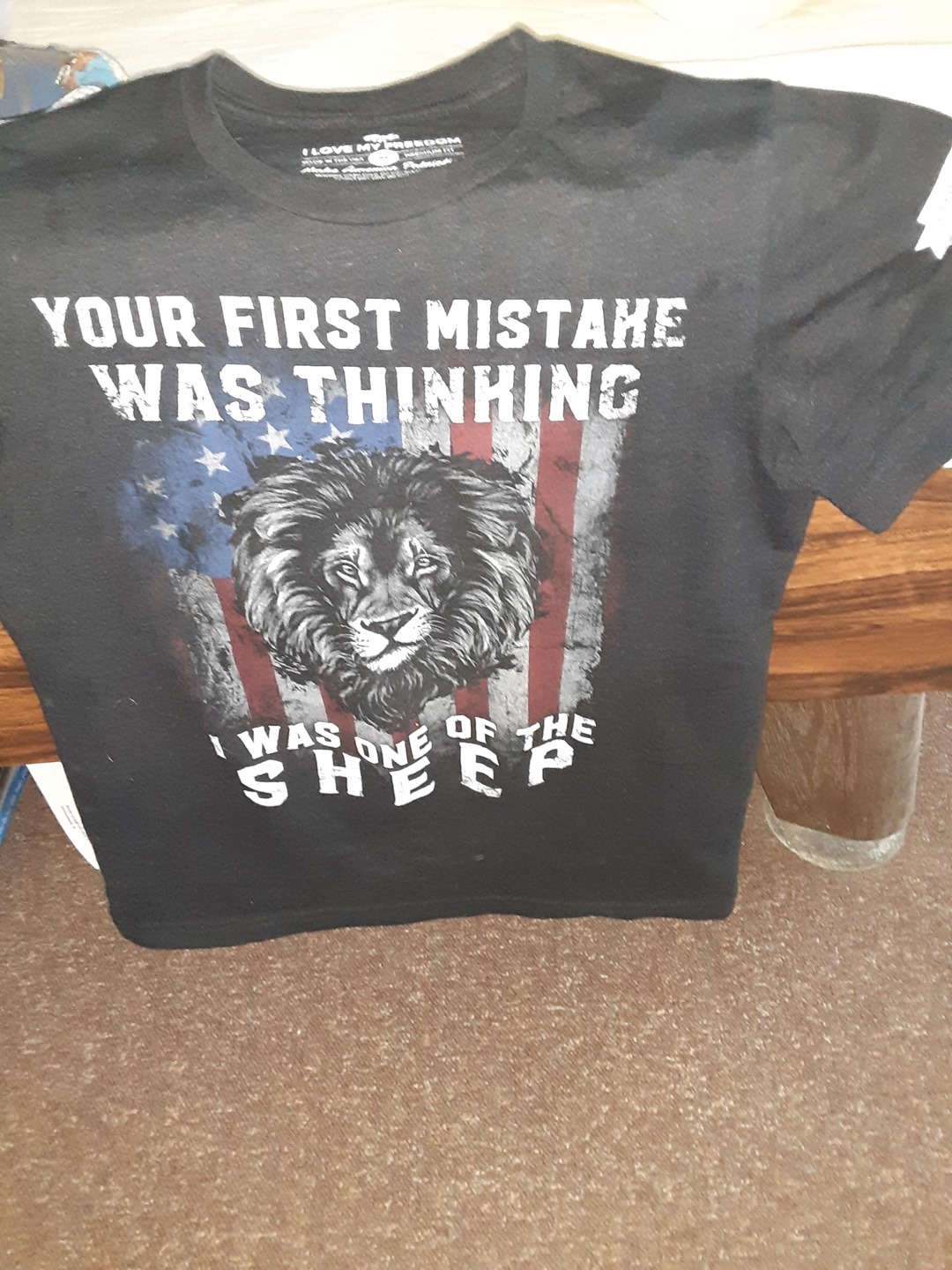 Your first mistake was thinking i was one of the sheep-The lion on American flag