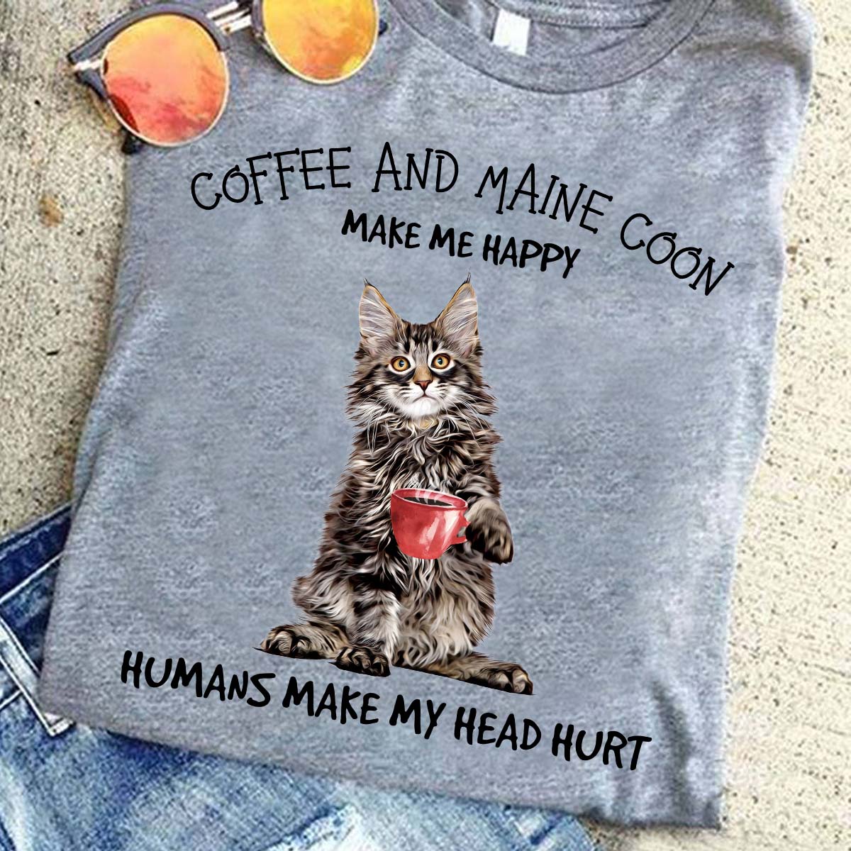 Maine Coon Cat is drinking Coffee