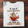 A cup of coffee and cats solve everything