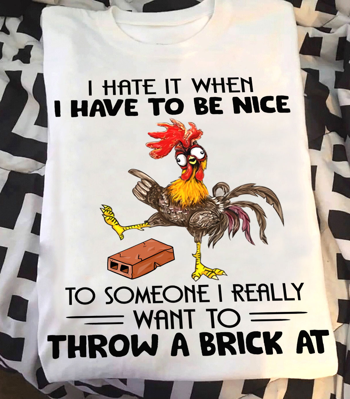 I hate it when I have to be nice to someone - Grumpy chicken with a brick