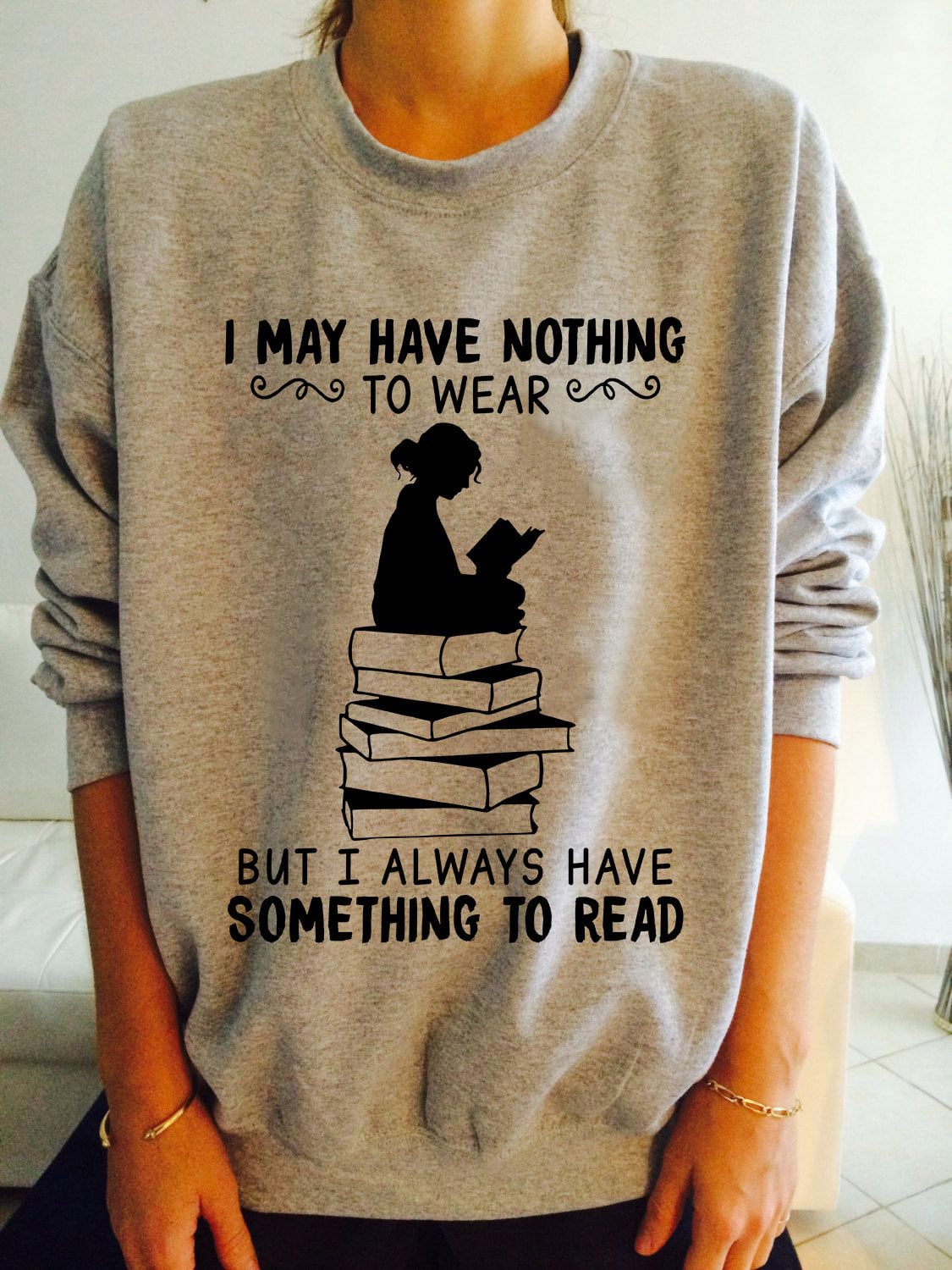 I may have nothing to wear but I always have something to read - Girl reading book