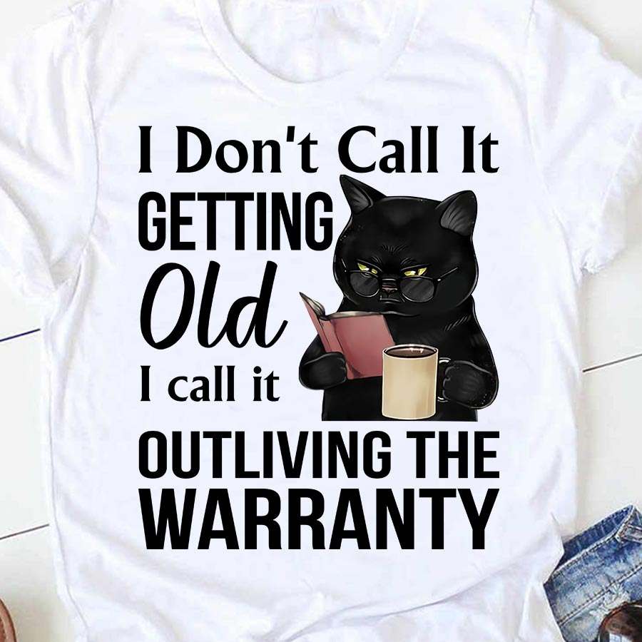 I don't call it getting old I call it outliving the warranty - Cat reading book, book and coffee