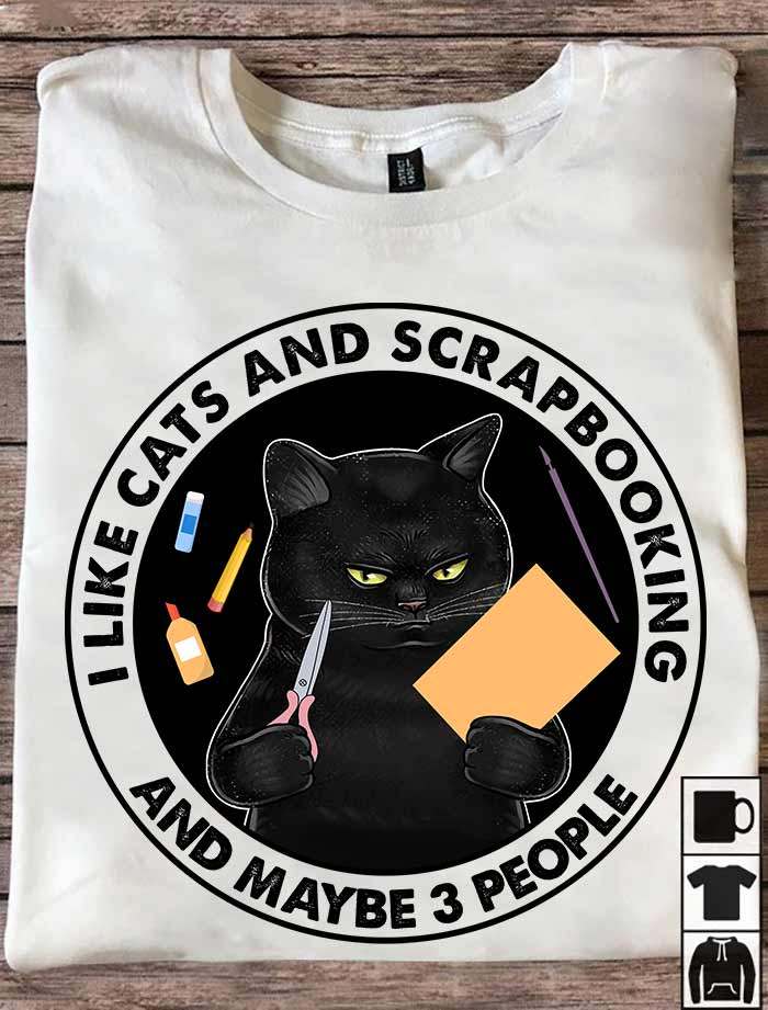 I like cats and scrapbooking and maybe 3 people - Black cat and paper