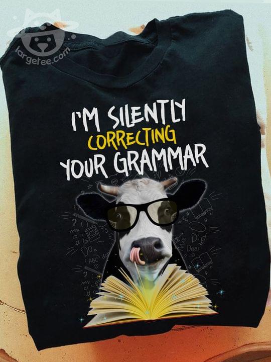 I'm silently correcting your grammer - Cow with book, book lover