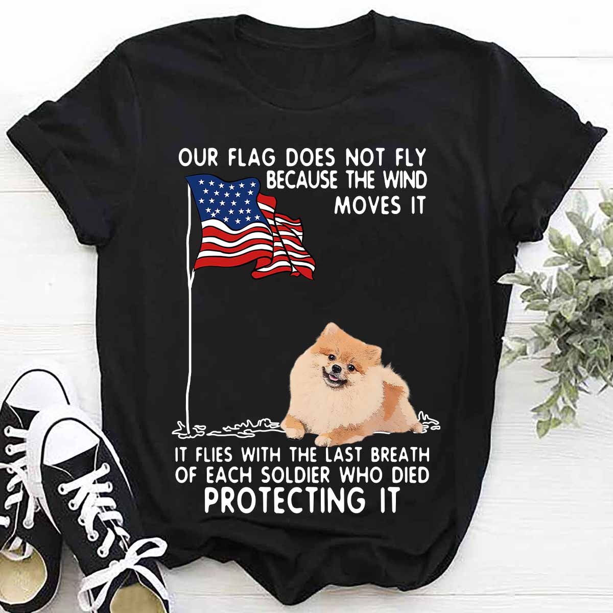 Our flag does not fly because the wind moves it it flies with the last breath - pomeranian dog and America flag