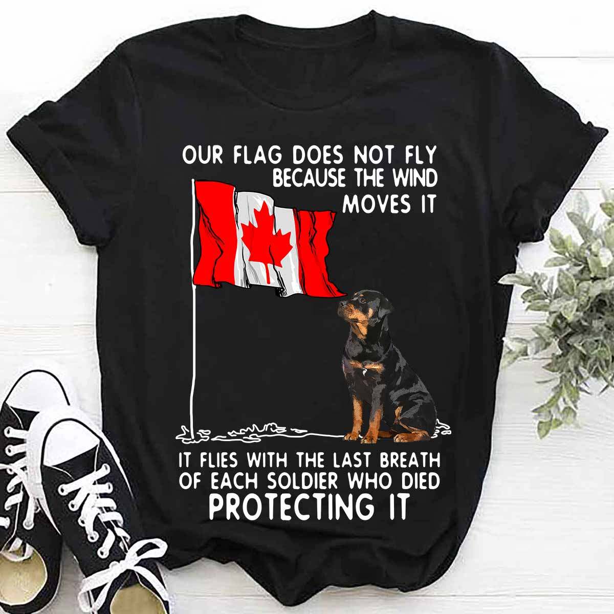 Our flag does not fly because the wine moves it - Rottweiler dog and Canada flag