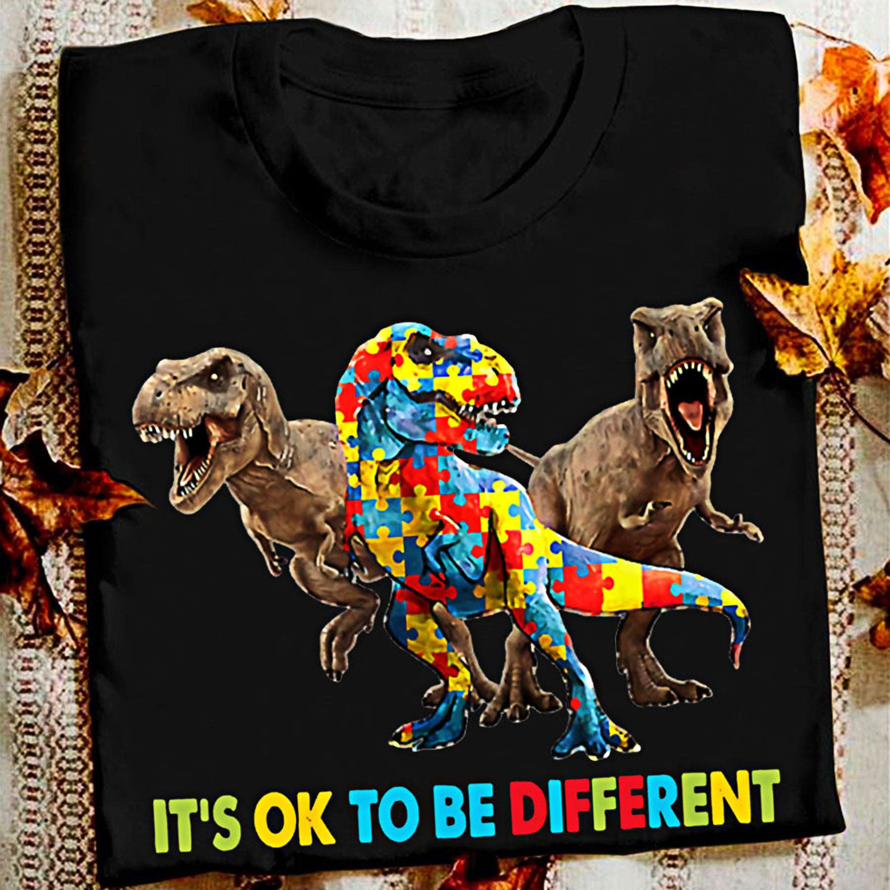 It's ok to be different - T-rex dinosaur, autism awareness