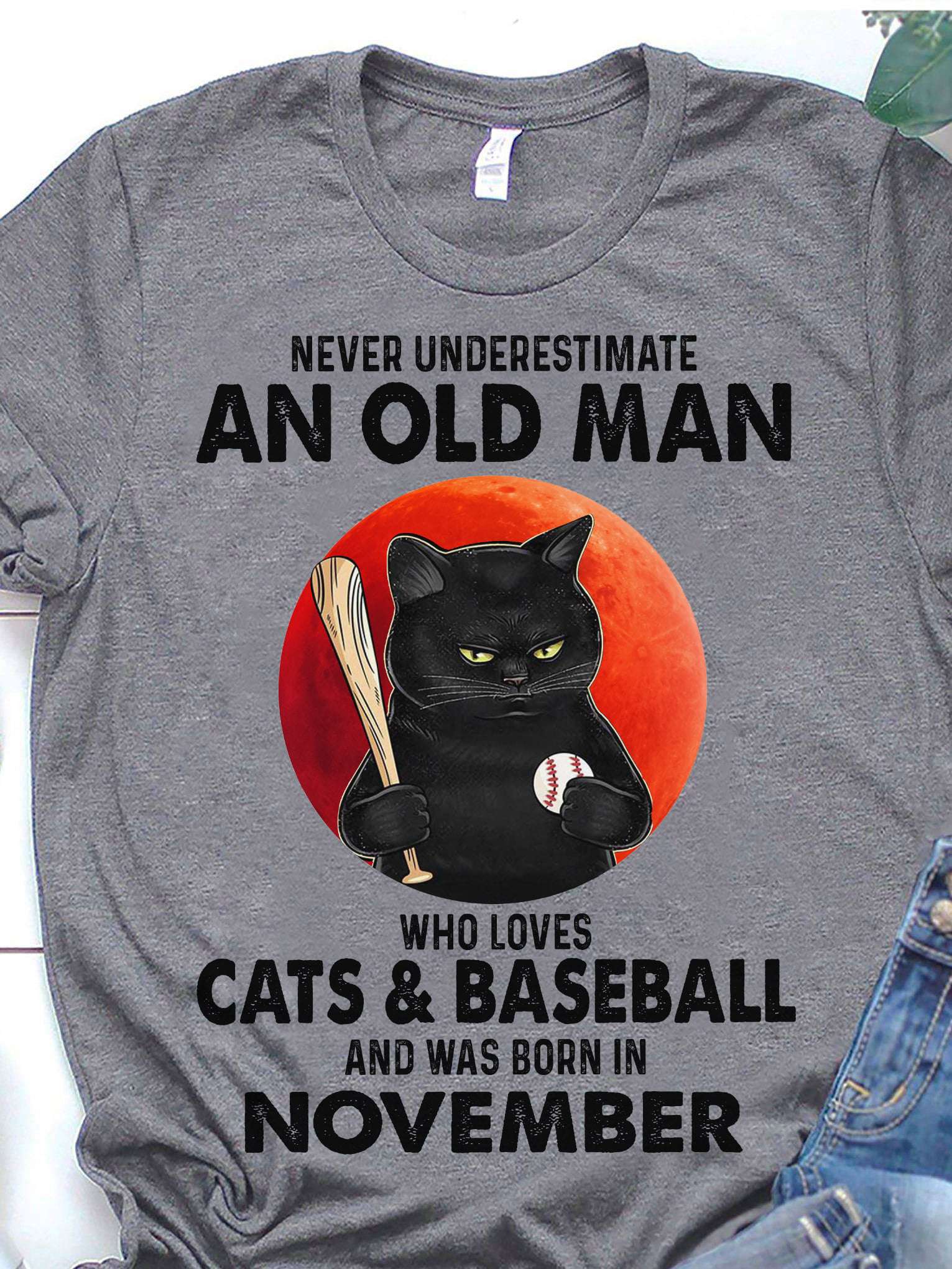 Never underestimate an old man who loves cats and baseball and was born in November