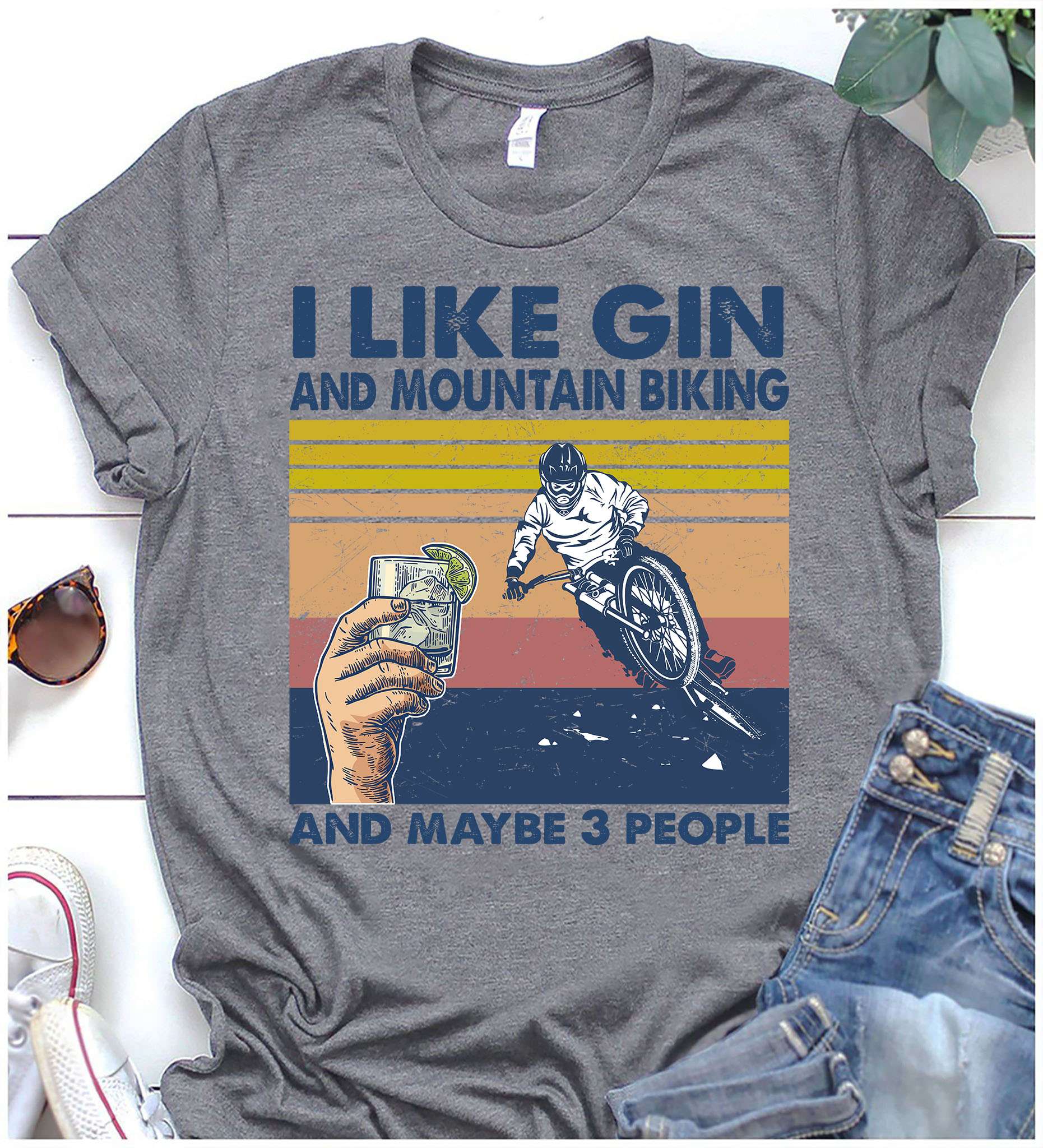 I like gin and mountain biking and maybe 3 people - Shot of gin, moutain biker