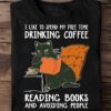 I like to spend my free time drinking coffee reading books and avoiding people - Black cat reading book, coffee and books