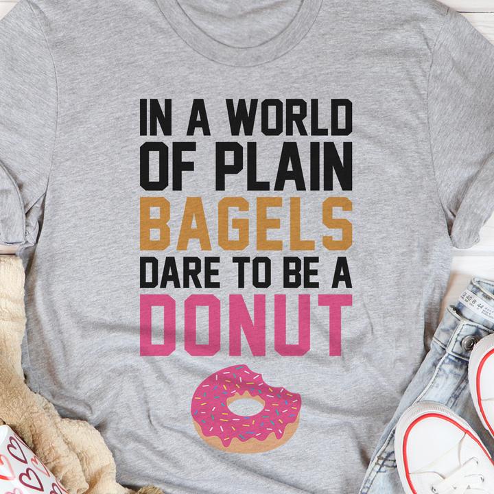 In a world of plain bagels, dare to be a Donut - Pink donut graphic T-shirt
