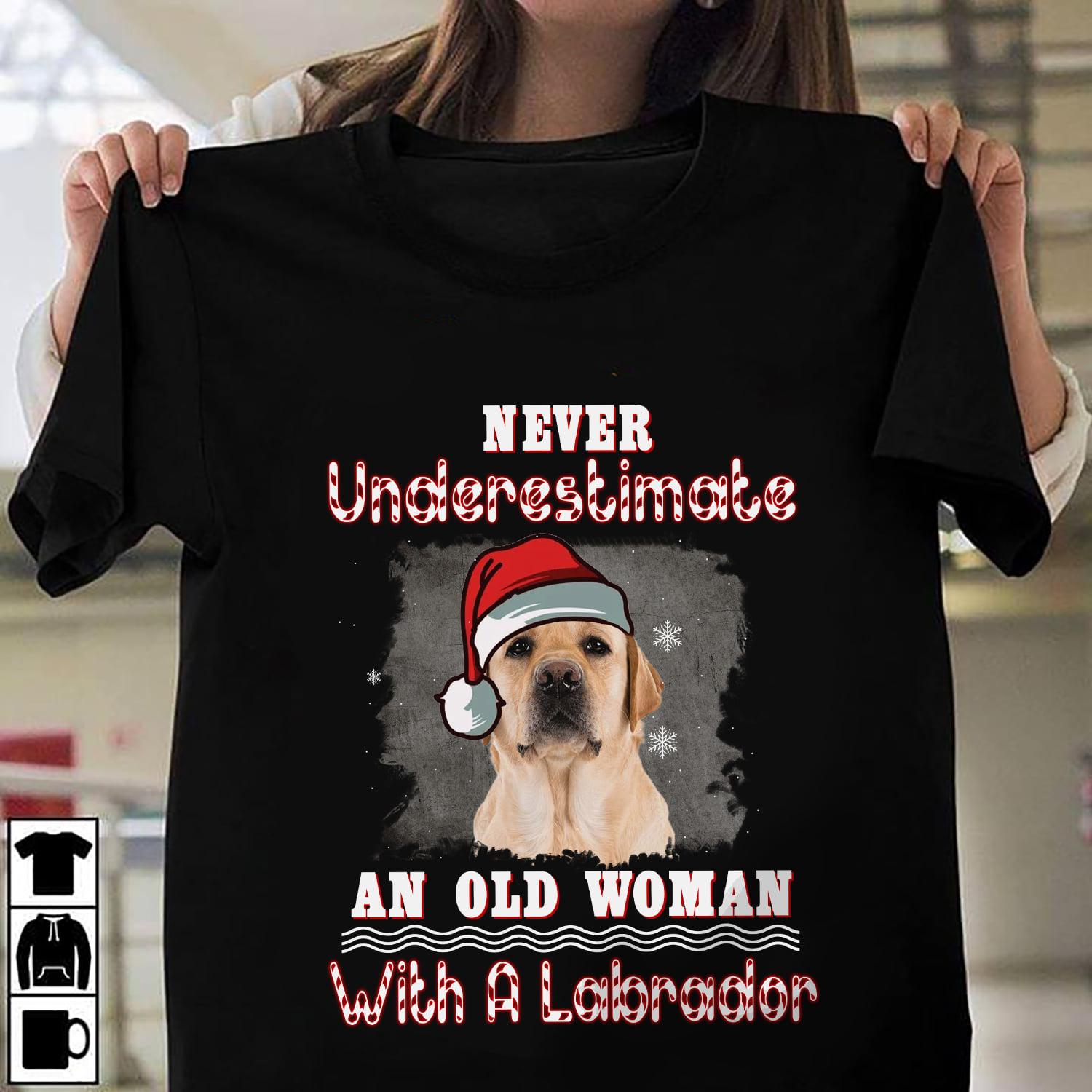 Never underestimate an old woman with a Labrador - Labrador wearing Christmas hat, Christmas day ugly sweater