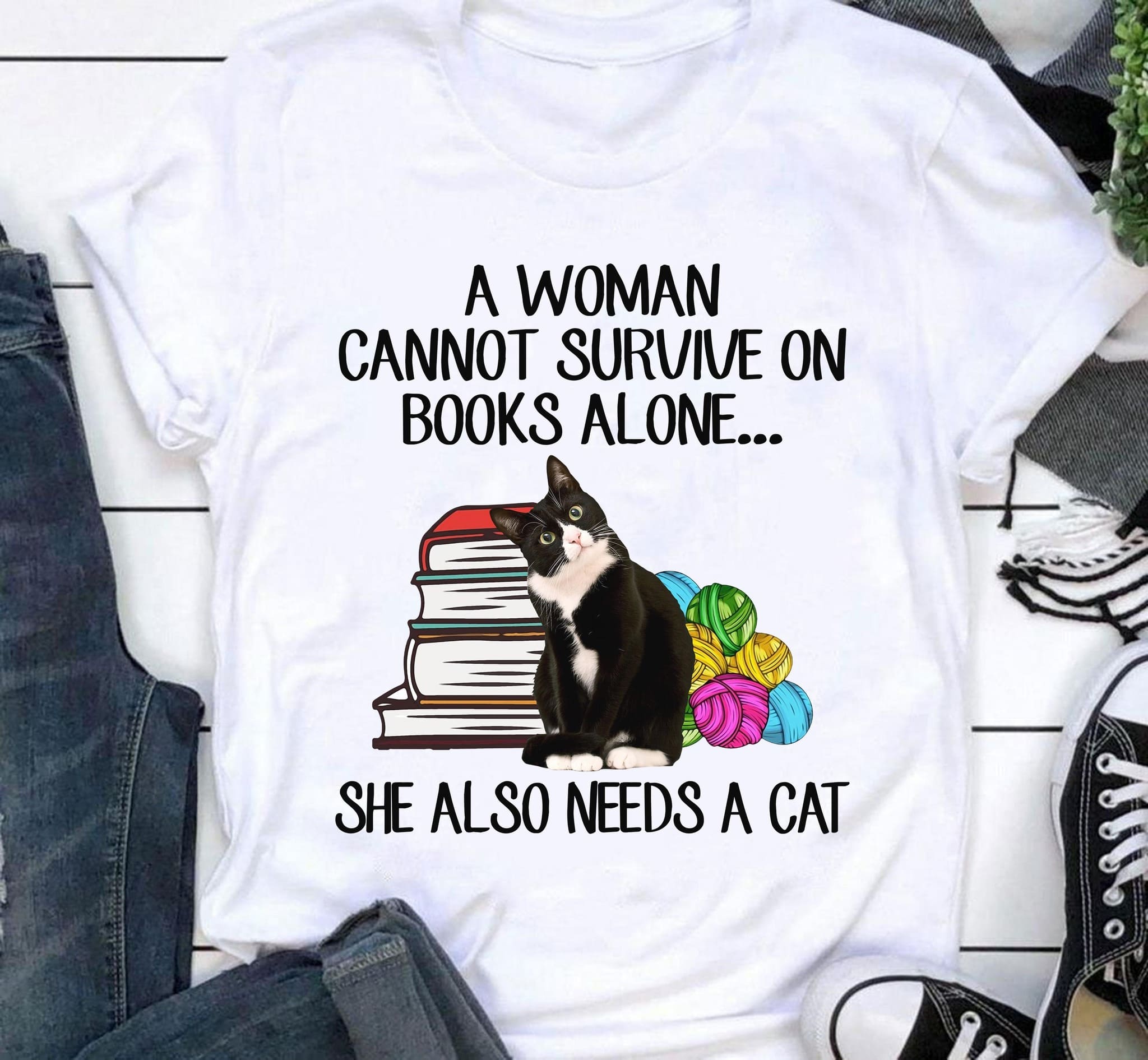 A woman cannot survive on books alone she also needs a cat - Cat and book, woman love books